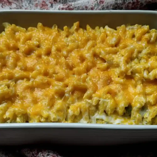 Homemade mac and cheese made with elbow macaroni, cheddar cheese, milk, butter, and baked to golden perfection