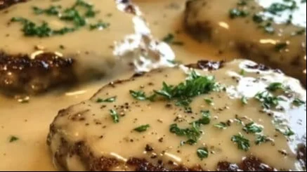 Amish Hamburger Steak Bake served on a plate with garnishes