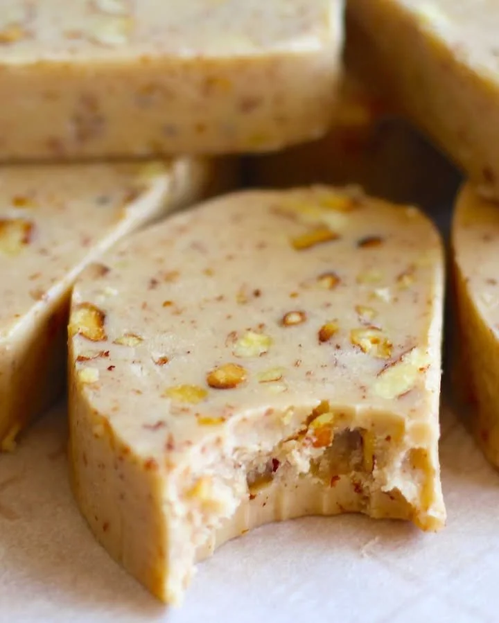 An assortment of beautifully decorated Christmas cookies on a festive plate.