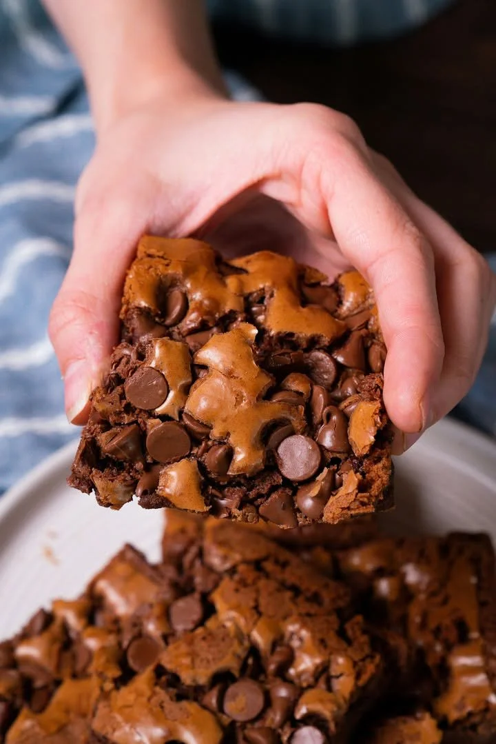 Snoop Dogg's delicious brownies with chocolate and nuts on a plate.