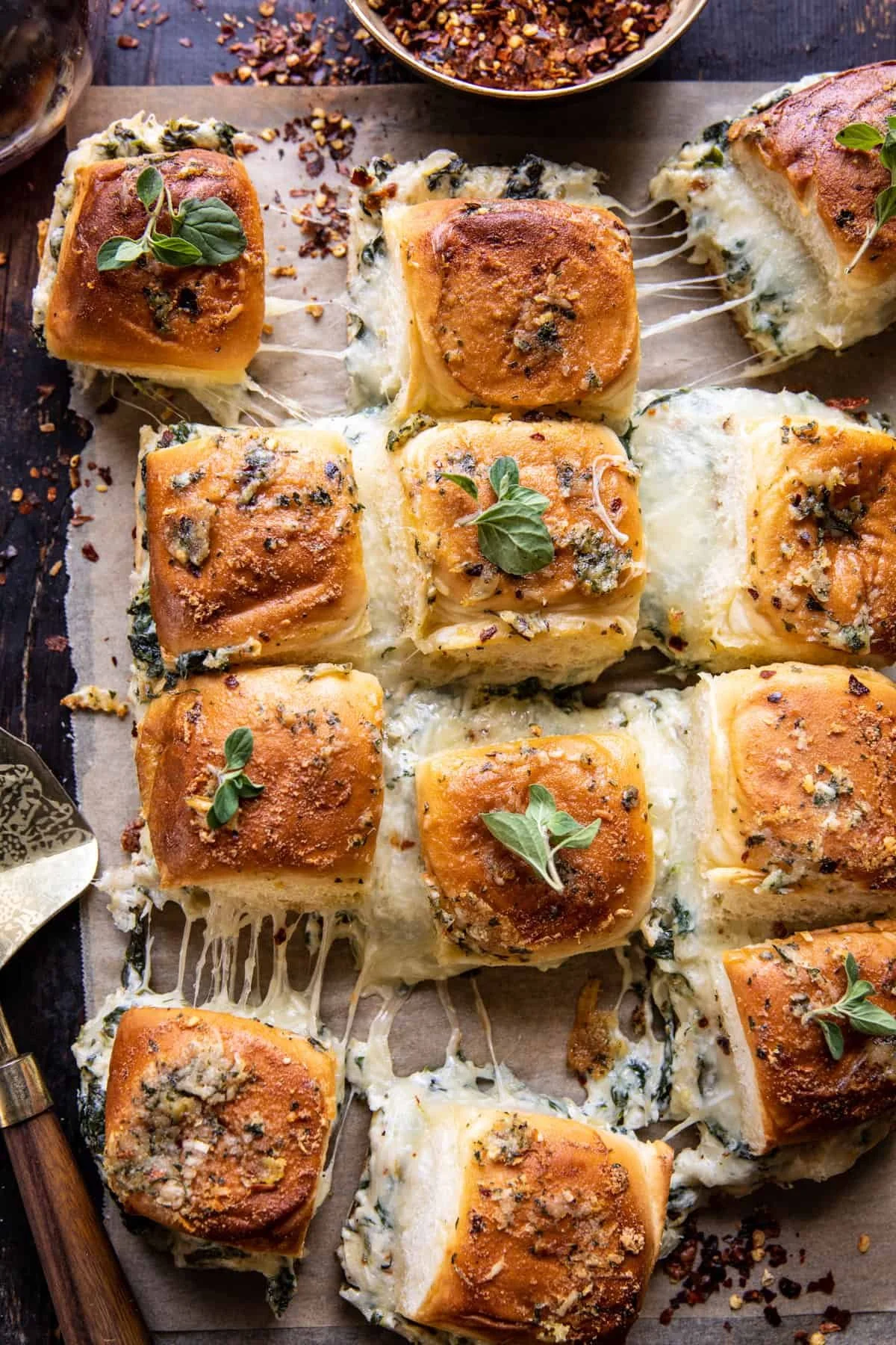 Delicious spinach artichoke pull-apart rolls served warm.