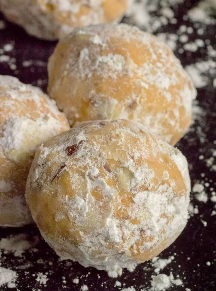 Delicious star-shaped dessert cookies decorated with icing and sprinkles.