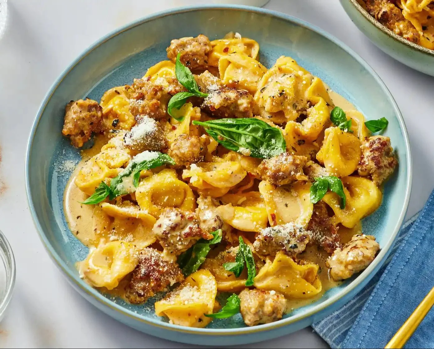 Creamy homemade hot cocoa topped with whipped cream and chocolate shavings