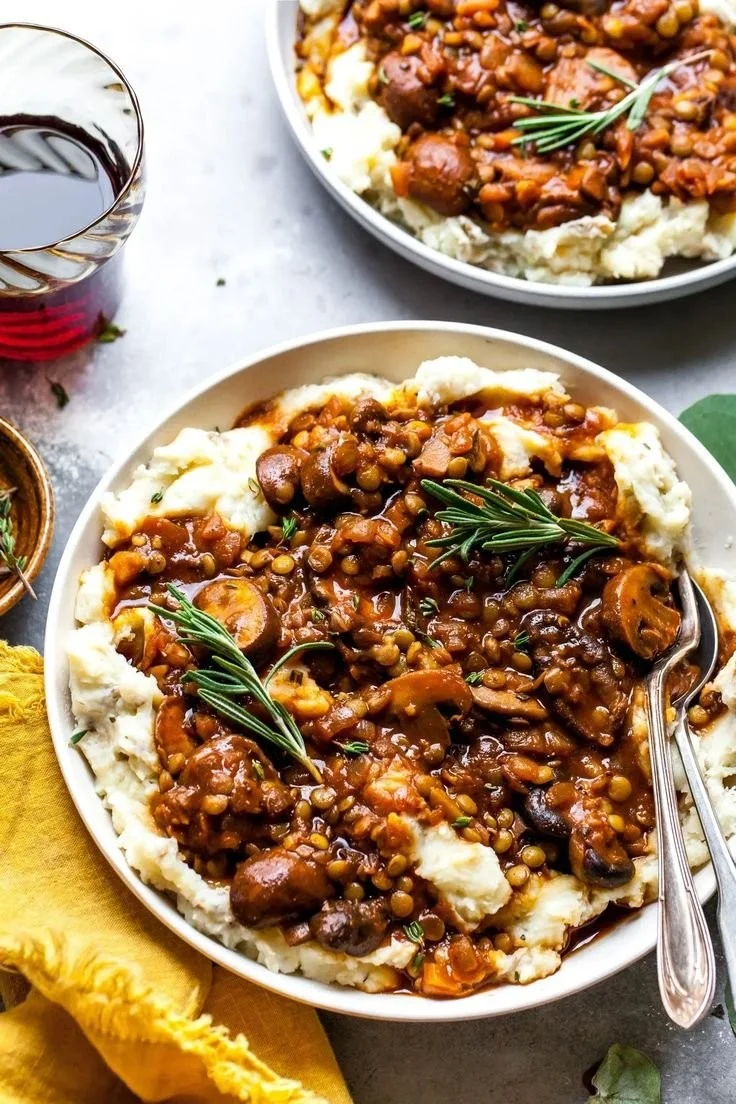 Bowl of hearty Lentil Mushroom Stew over creamy Potato-Parsnip Mash