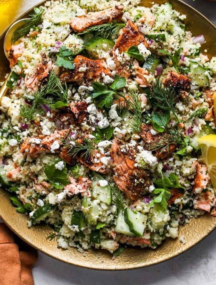 Colorful Salmon Couscous Salad with fresh vegetables and herbs