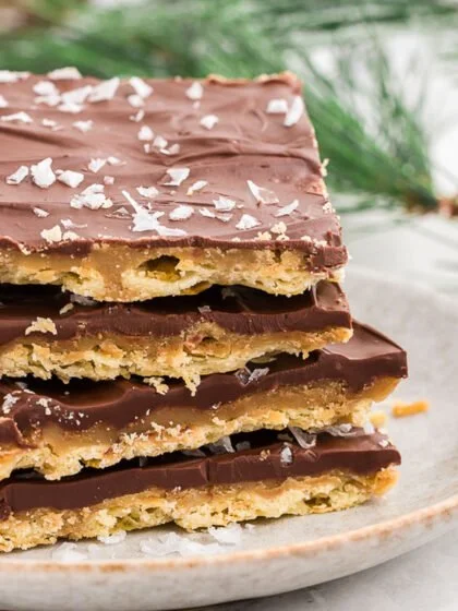 Homemade Saltine Toffee with chocolate and caramel on a baking sheet.