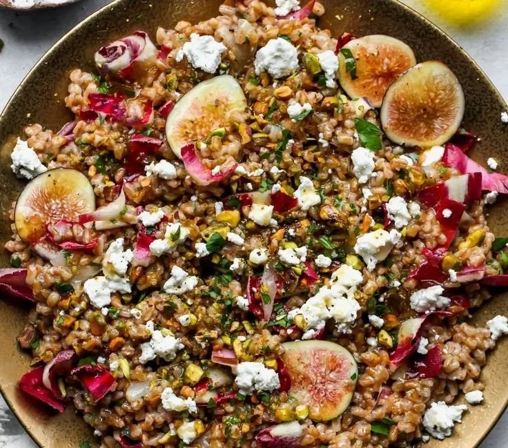Warm Farro Salad with Fig Vinaigrette featuring fresh greens and figs