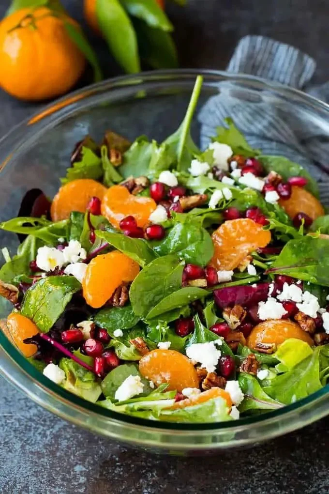 Colorful winter salad with seasonal greens and toppings for a healthy meal.